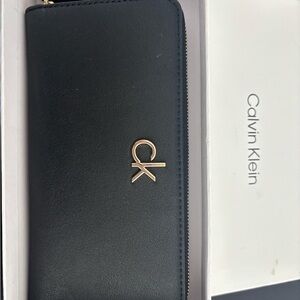 Calvin Klein Black Leather Zip Wallet with Gold Hardware